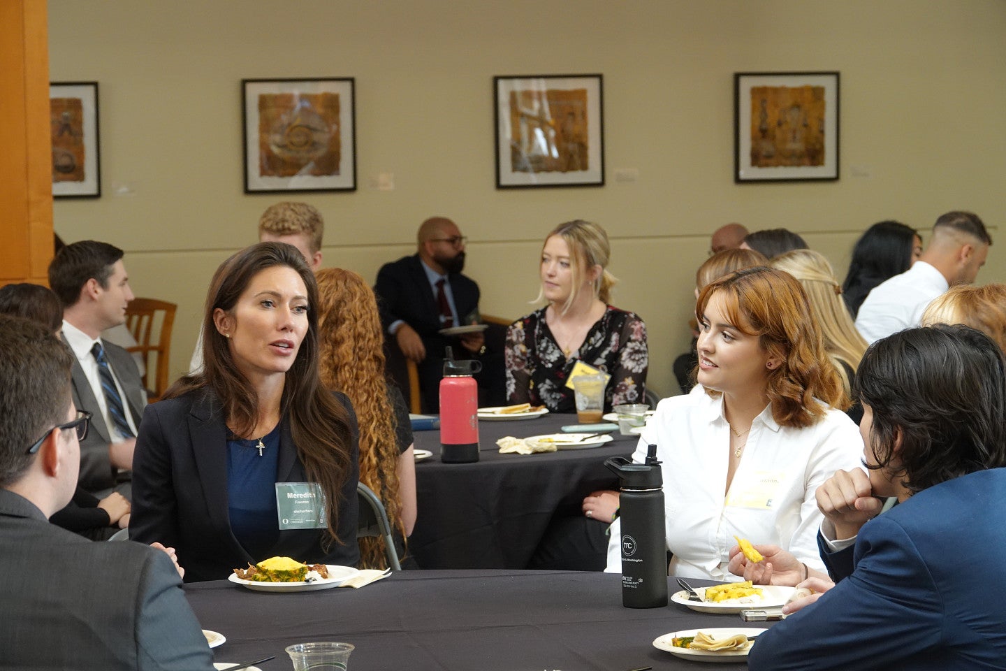 Alumna speaking with newly matriculated students