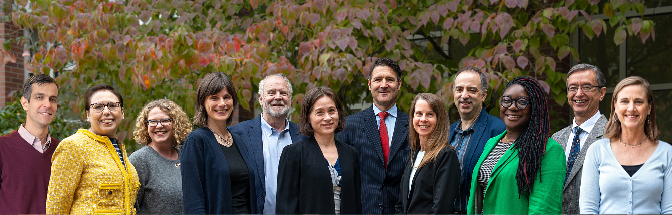 An image of the business law faculty members in the law school courtyard