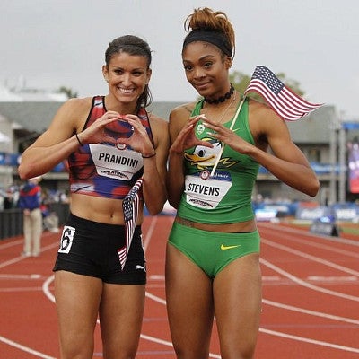 two track and field athletes showing their Oregon love