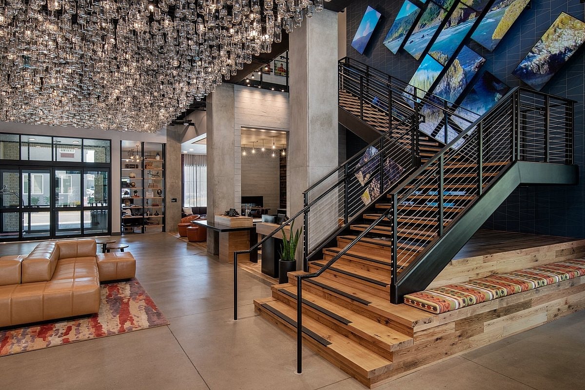 Lobby of the Gordon Hotel with warm wood and modern industrial features