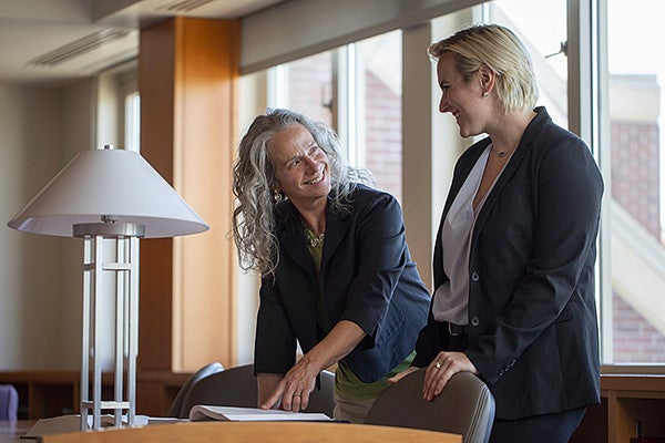 Professor Roberta Mann smiling at student