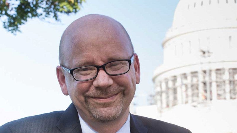 Greg Dotson next to the US Capitol Building