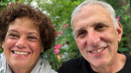 Nan with her husband, Paul, with a garden in the background
