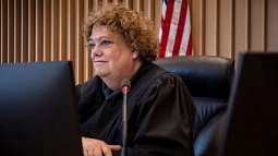 Judge Nan Waller, seated, presides over her courtroom.