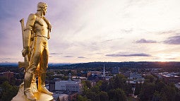 Oregon Capitol Building statue overlooking city of Salem