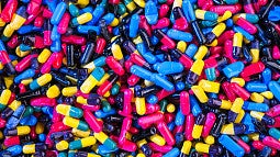 color prescription pills spilled on table
