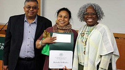 Provost Jayanth Banavar and Dean Marcilynn Burke present Michelle McKinley with the Distinguished Teaching Award