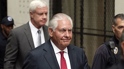 Rex Tillerson, center, former chief executive officer of Exxon Mobil Corp., departs from state court in New York on Oct. 30, 2019.