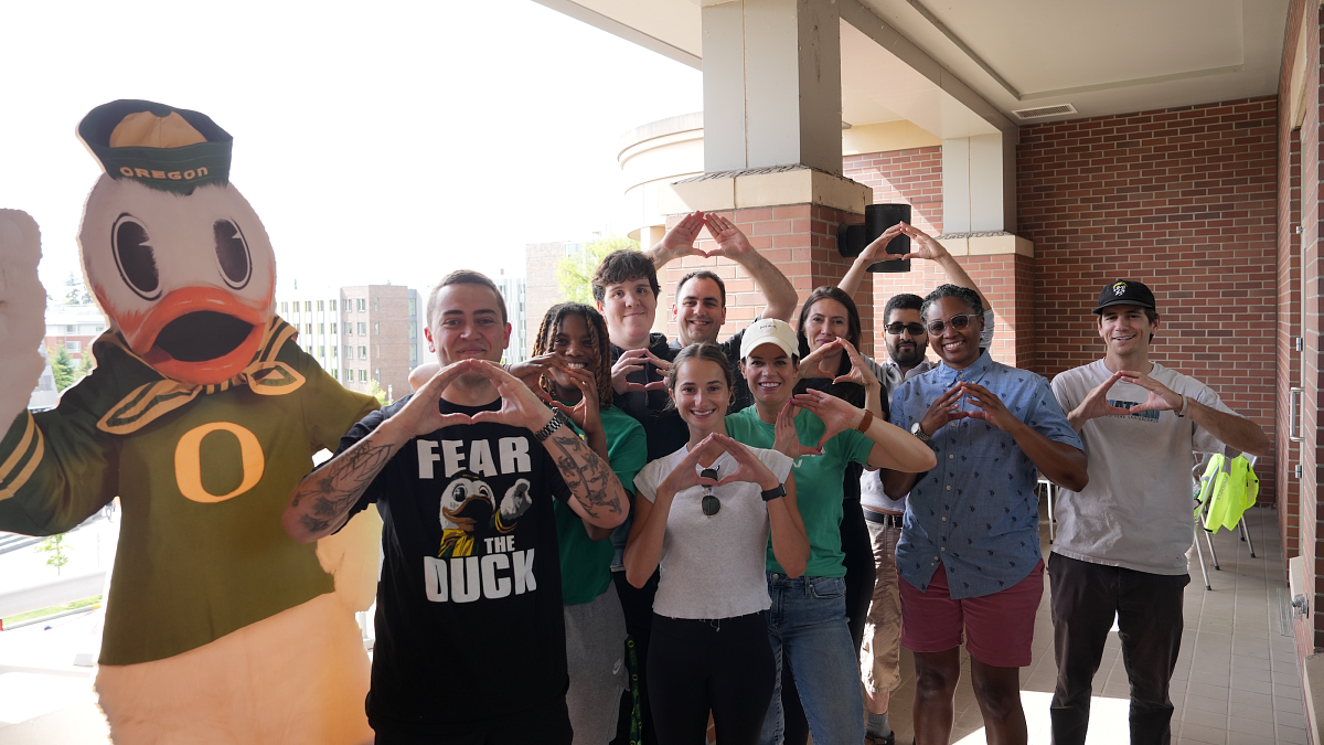 SSLI participants "throwing the O" on the law school balcony