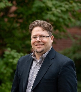Headshot of Professor Erik Girvan