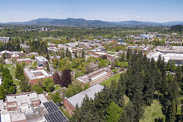 aerial shot of UO campus with mountains in background