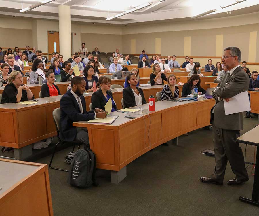 A professor giving a lecture A professor giving a lecture