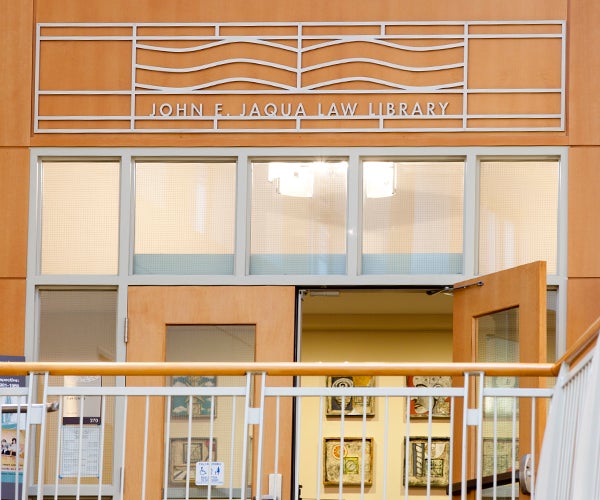 tight shot of front entrance with library name