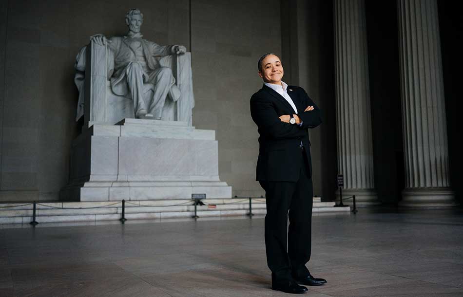 Rose Gibson proudly stands by the Lincoln Memorial statue in Washington DC.
