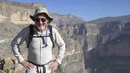 Roy Dwyer in front of the Grand Canyon of Oman