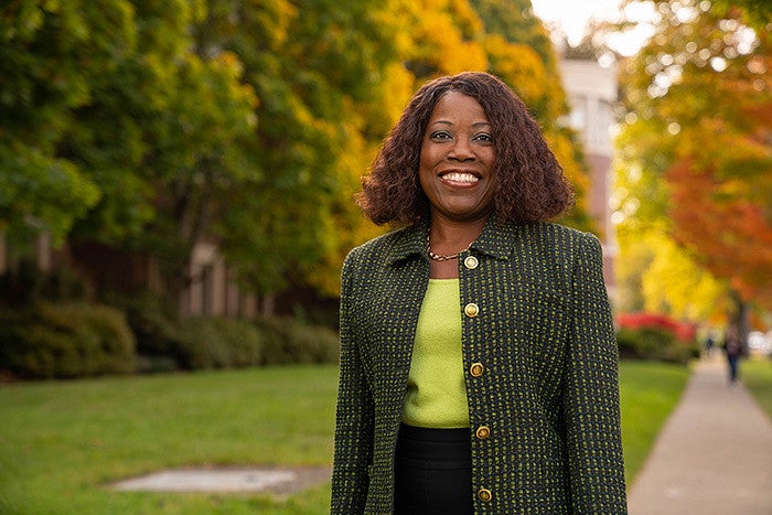 A portrait of Dean Burke against brilliant fall foliage