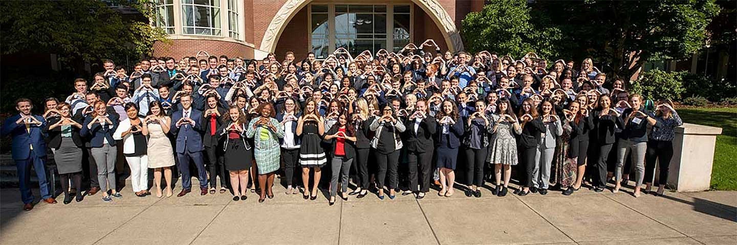 Law School students throwing the O during orientation