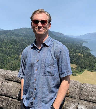 Man smiling scenic back ground