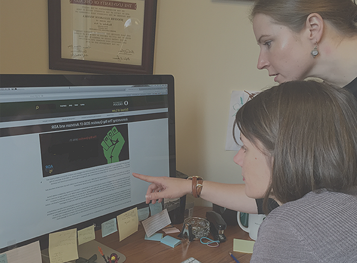 Jen Reynolds working with a student on the computer