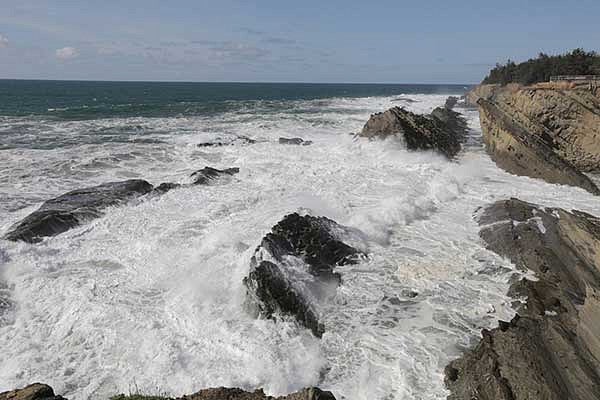 Waves breaking against the rocky coastline on the Oregon coast
