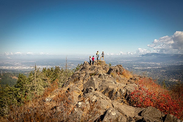 hikers at the top of a peak
