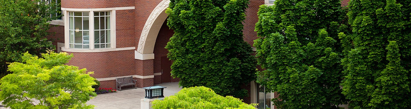 Knight Law Center Entry framed by green trees