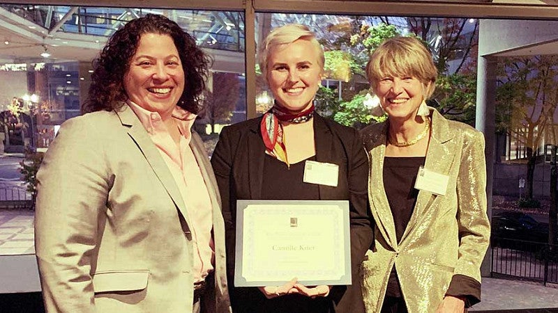 Camille Krier completed 350 pro bono hours at the Riverside (CA) County Public Defender’s Office and was awarded “Most Pro Bono Hours” by a law student in the State of Oregon Camille Krier holding her award with Chief Justice Martha Walters and Oregon State Bar President Christine R. Constantino