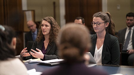Catherine Pratt JD '20 and Renee Seacor JD '20 present their research on the challenge and opportunity of increasing tree cover in urban areas