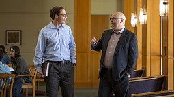 Professor Robert Illig walking with a student