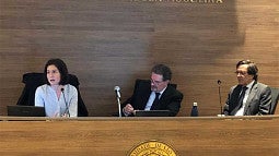 Elizabeth Tippett, Alberto do Amara Jr.,  and Alberto do Amara Jr. speaking on a panel