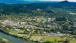 long distance aerial shot of Eugene from the Willamette river looking south