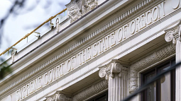 photo of words on the supreme court building spelling out "supreme court of the state of oregon"