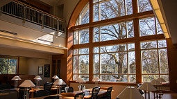 3rd floor law library large window with sunlight on study desks