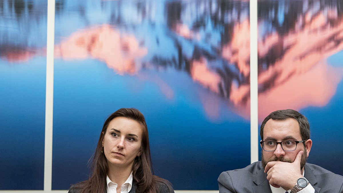 Two ENR law students waiting to present before a committee at the white house.