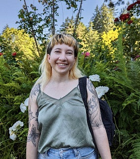 young person smiling in garden