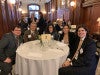 Judge John V. Acosta sitting with students a networking event
