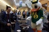 Puddles enjoys the buffet with faculty